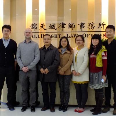 Projects Abroad Business Interns pose for a photo in a Law Office during a Business Internship in China. A group of Business Interns pose for a group photo infront of a reception desk at a law office in China.